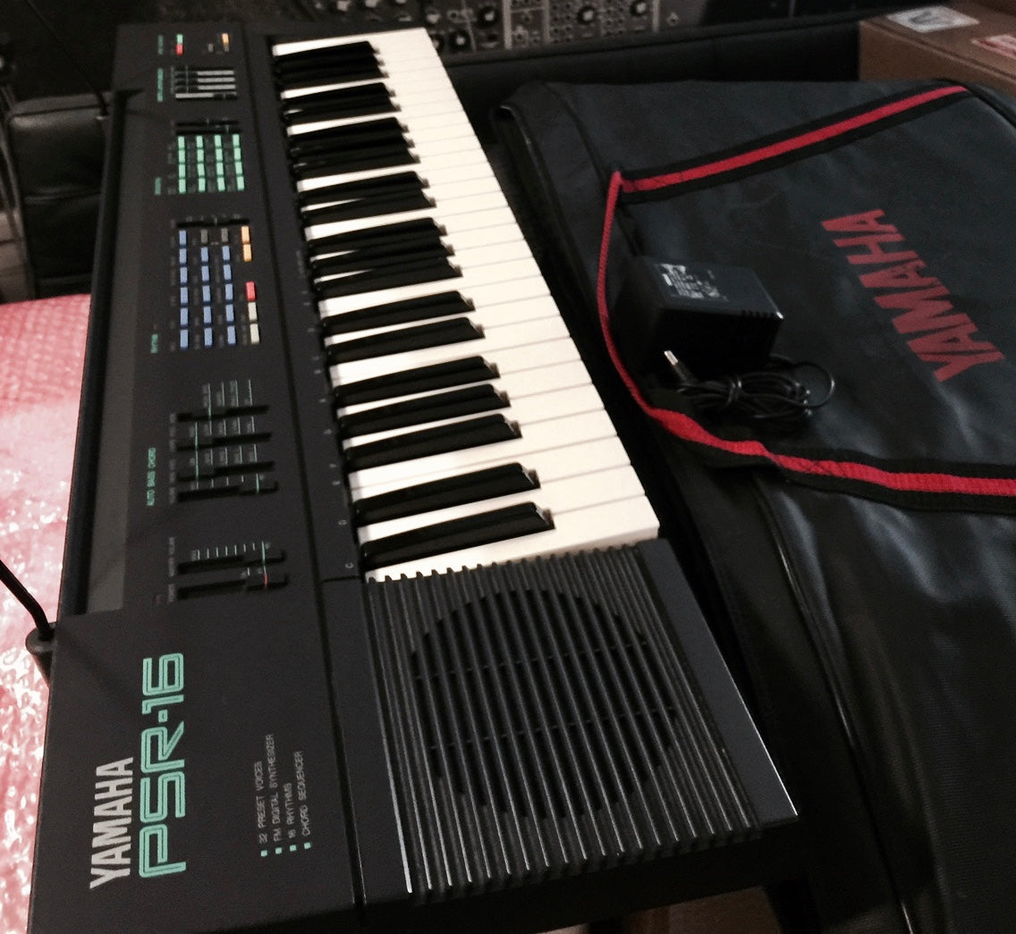 Yamaha PSR-16 keyboard w/optional soft case, power supply and music rack